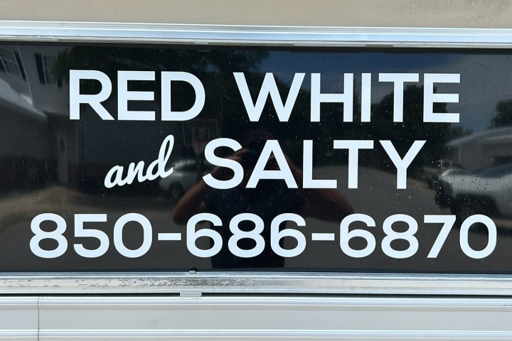 Window with text: 'Red White and Salty' and a phone number '850-686-6870'.